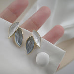 Korean Gray White Leaf Design Gold Steel Earrings
