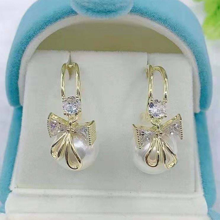 Golden and White Pearl Bow Tie Dangling Korean Fashion Earring