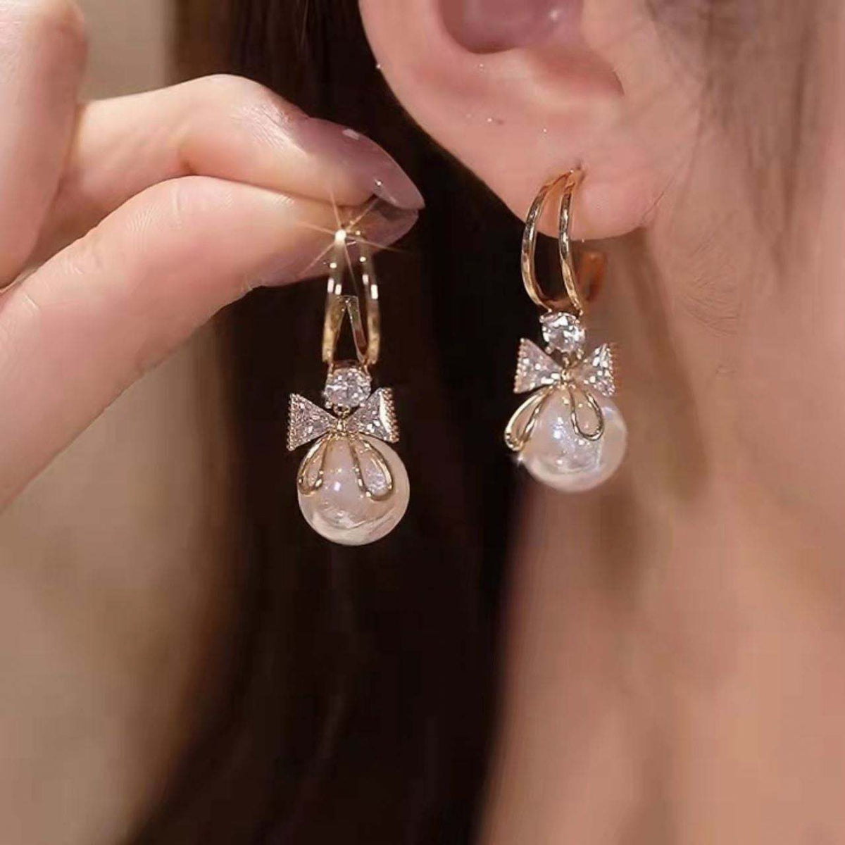 Golden and White Pearl Bow Tie Dangling Korean Fashion Earring