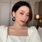 Golden and White Pearl Bow Tie Dangling Korean Fashion Earring