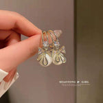 Golden and White Pearl Bow Tie Dangling Korean Fashion Earring
