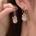 Golden and White Pearl Bow Tie Dangling Korean Fashion Earring
