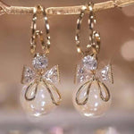 Golden and White Pearl Bow Tie Dangling Korean Fashion Earring