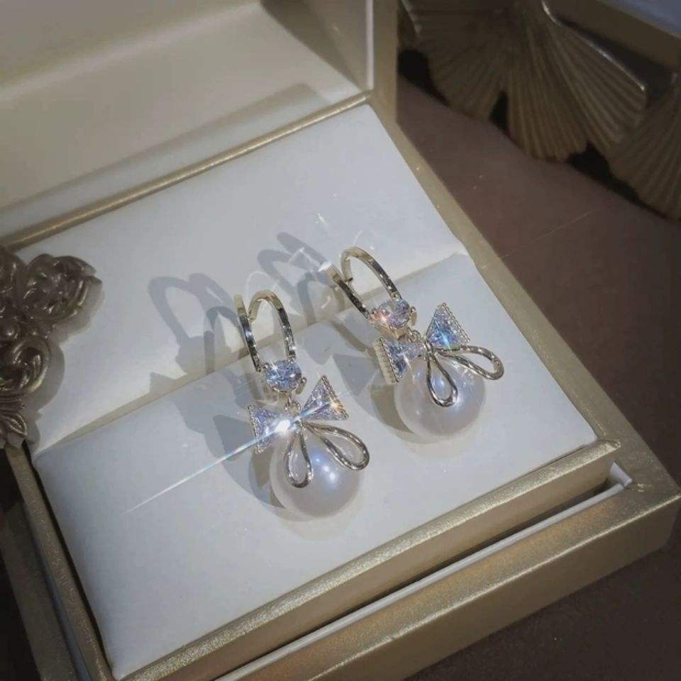 Golden and White Pearl Bow Tie Dangling Korean Fashion Earring
