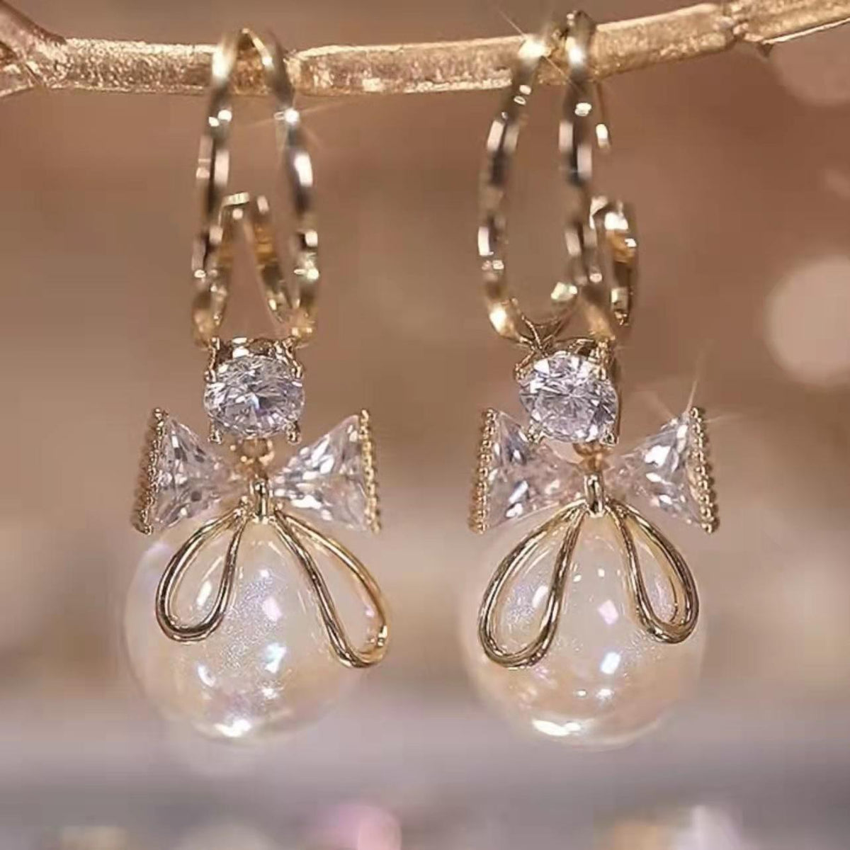Golden and White Pearl Bow Tie Dangling Korean Fashion Earring