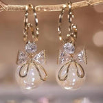 Golden and White Pearl Bow Tie Dangling Korean Fashion Earring