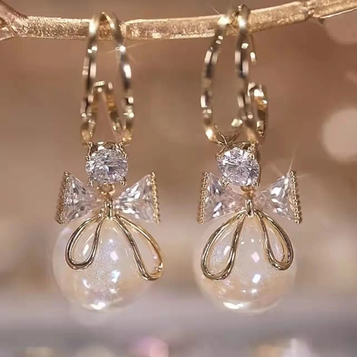 Golden and White Pearl Bow Tie Dangling Korean Fashion Earring