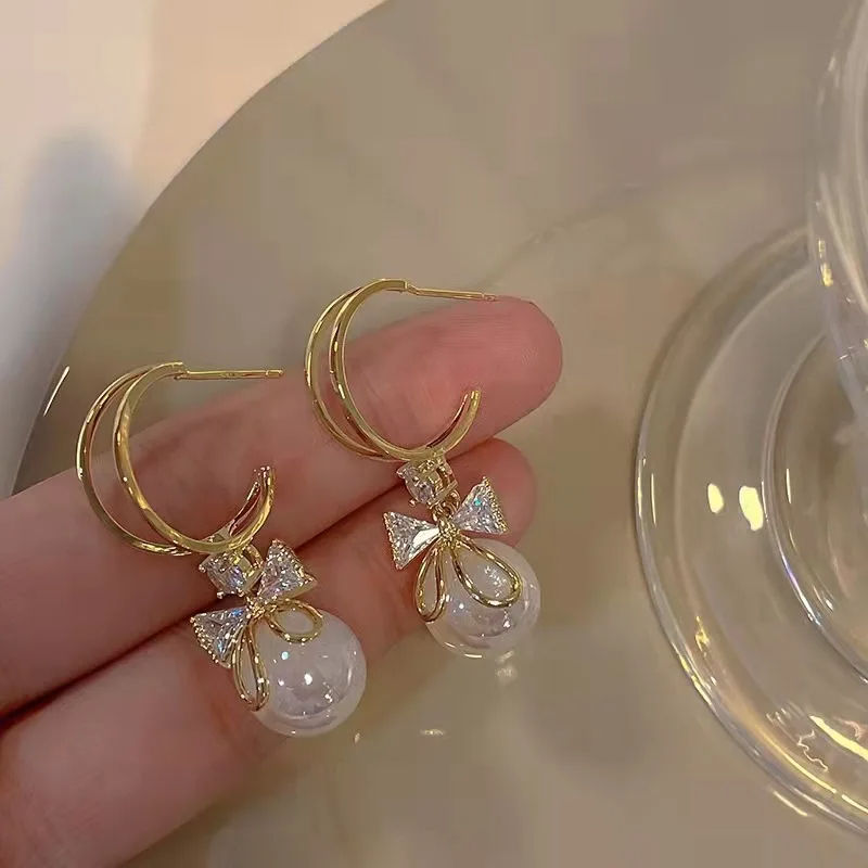Golden and White Pearl Bow Tie Dangling Korean Fashion Earring